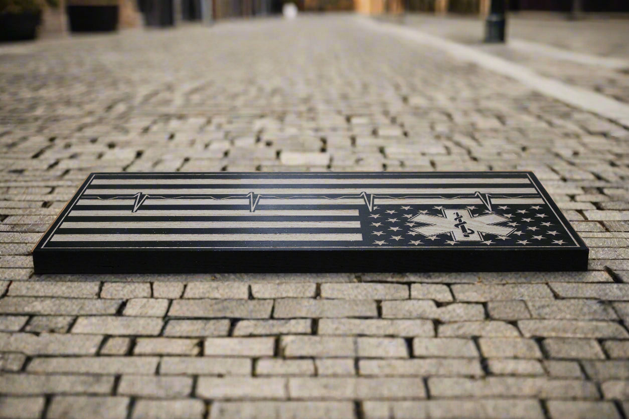 carved Ems wood flag with heartbeat design