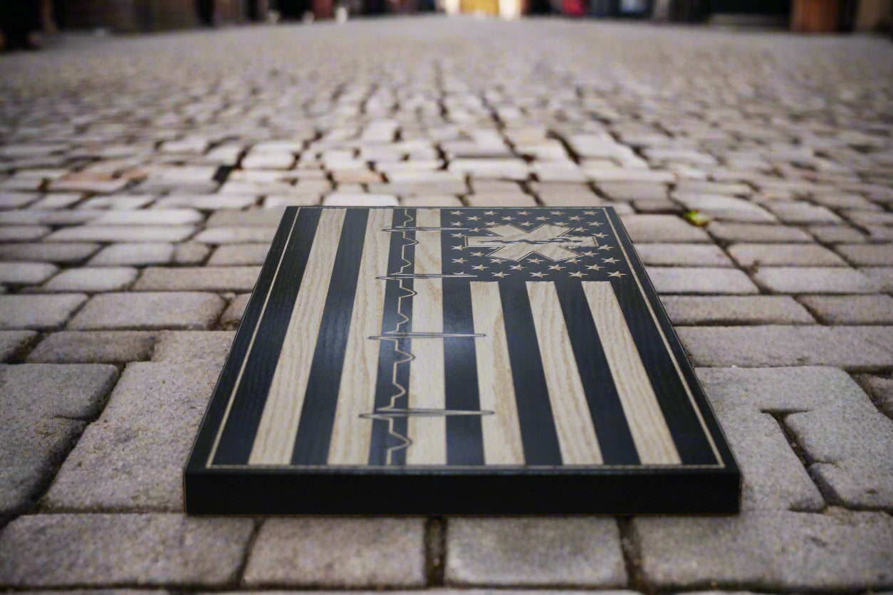 carved Ems wood flag with heartbeat design