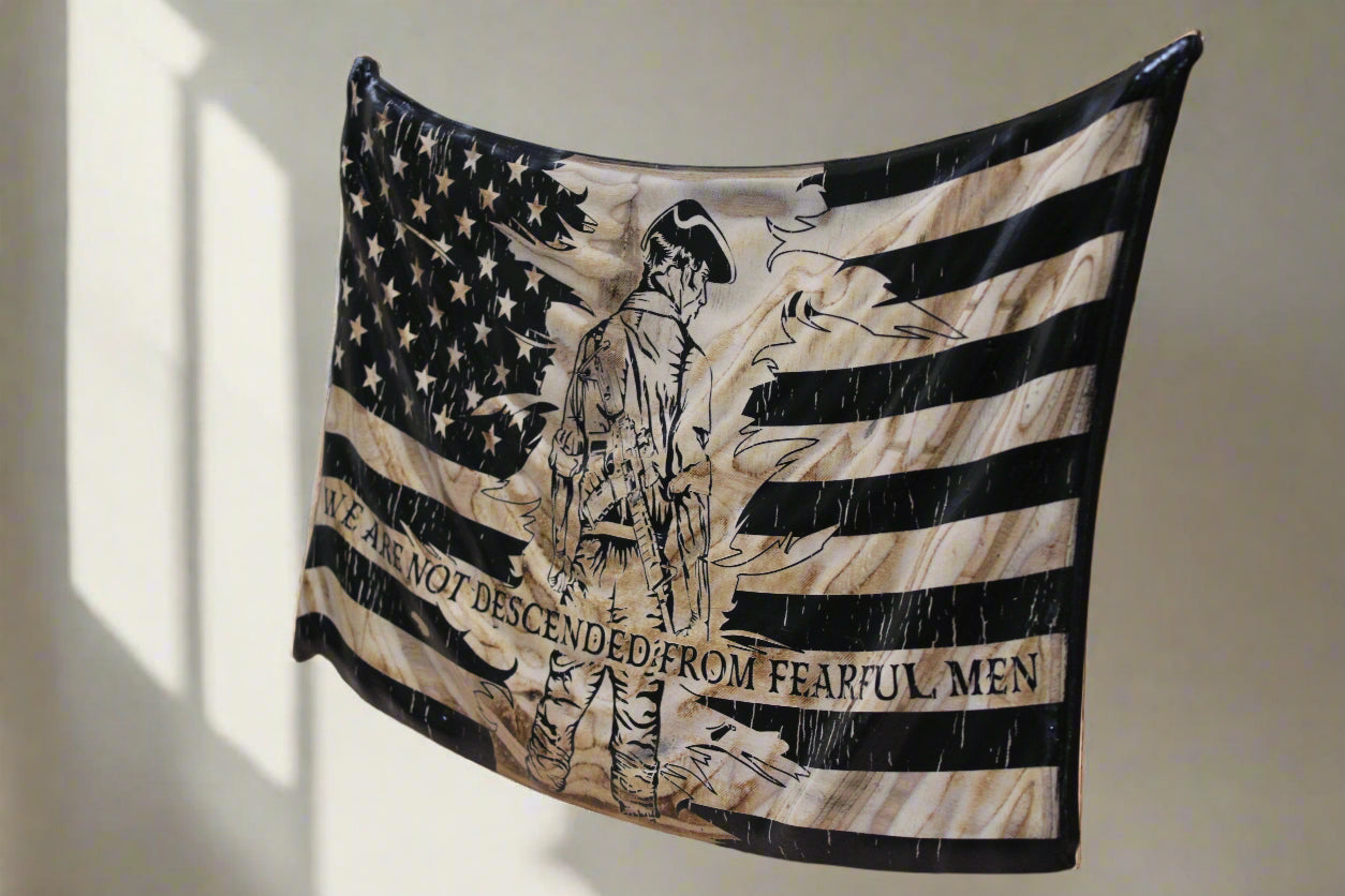 Wooden plaque with American flag design and text on a wooden surface
