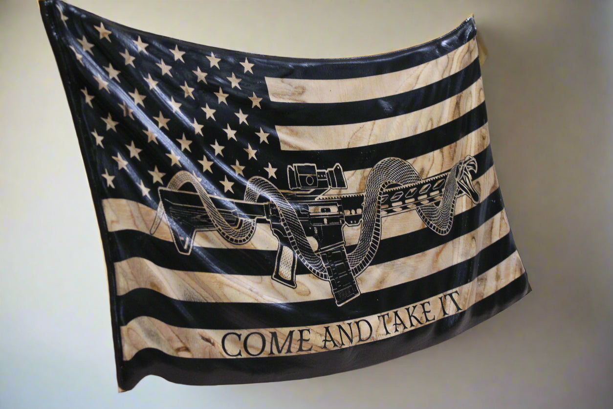 Side view of hand-crafted wavy wooden flag with flowing wave design and engraved rifle motif