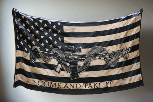 carved wavy “Come and Take It” wooden flag with M4 rifle & coiled snake, rustic patriotic wall art