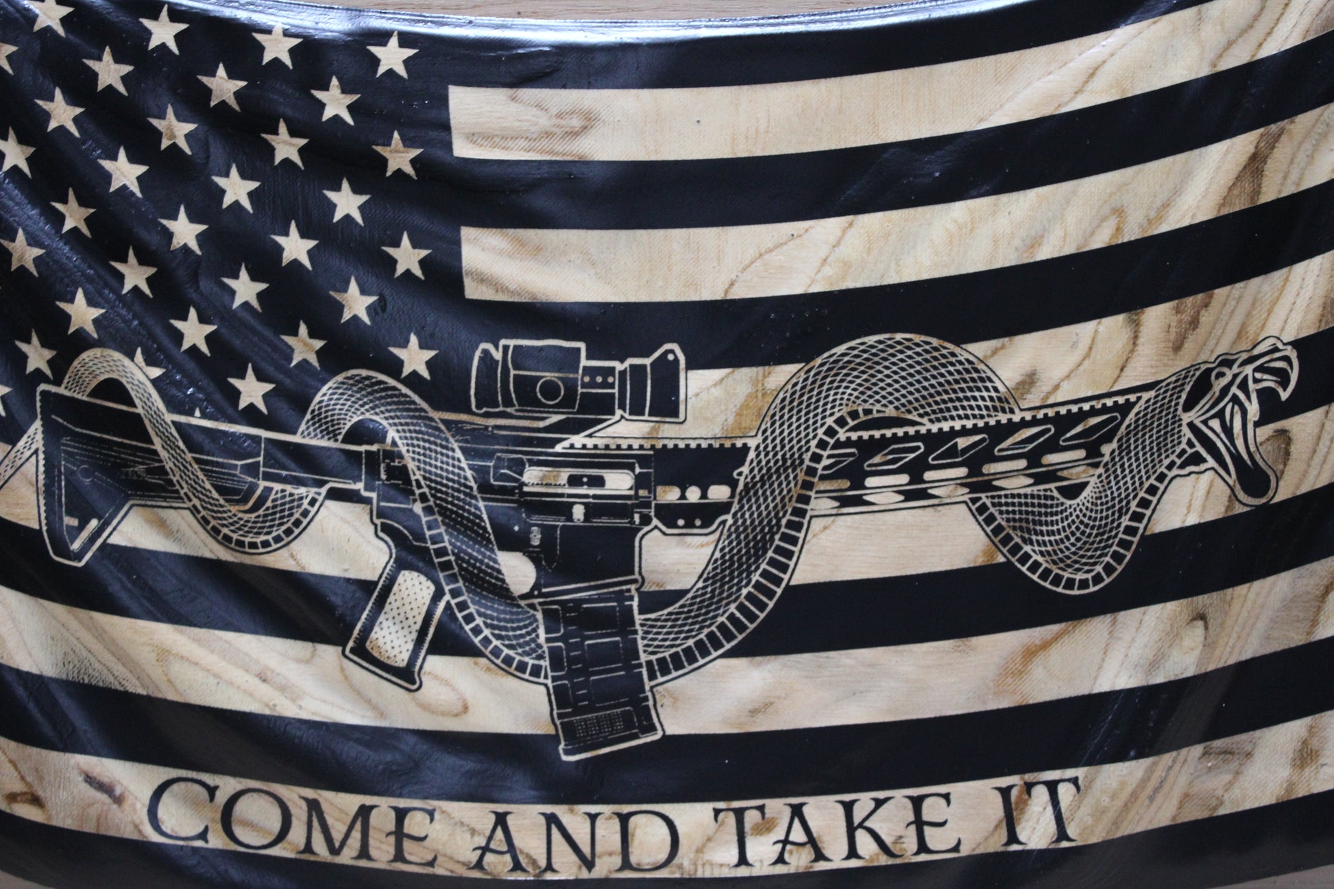 Rustic wavy “Come and Take It” wooden flag displayed in living room patriotic décor